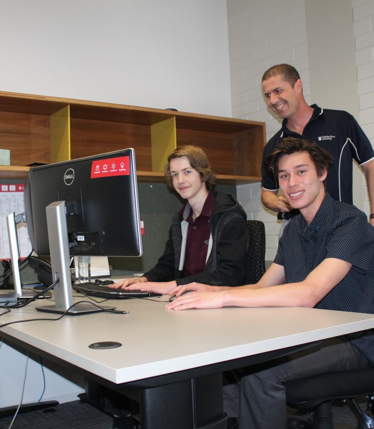 Year 11 students Thomas Sutton and Peter Froon with Rob Boetto, DIT Wagga Wagga campus